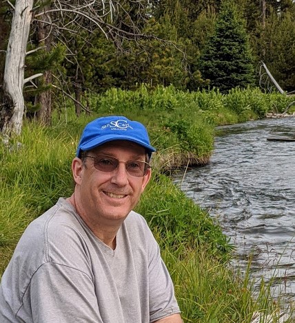 David Lomax, author of Trail of Thoughts, photographed at an Alaska river
